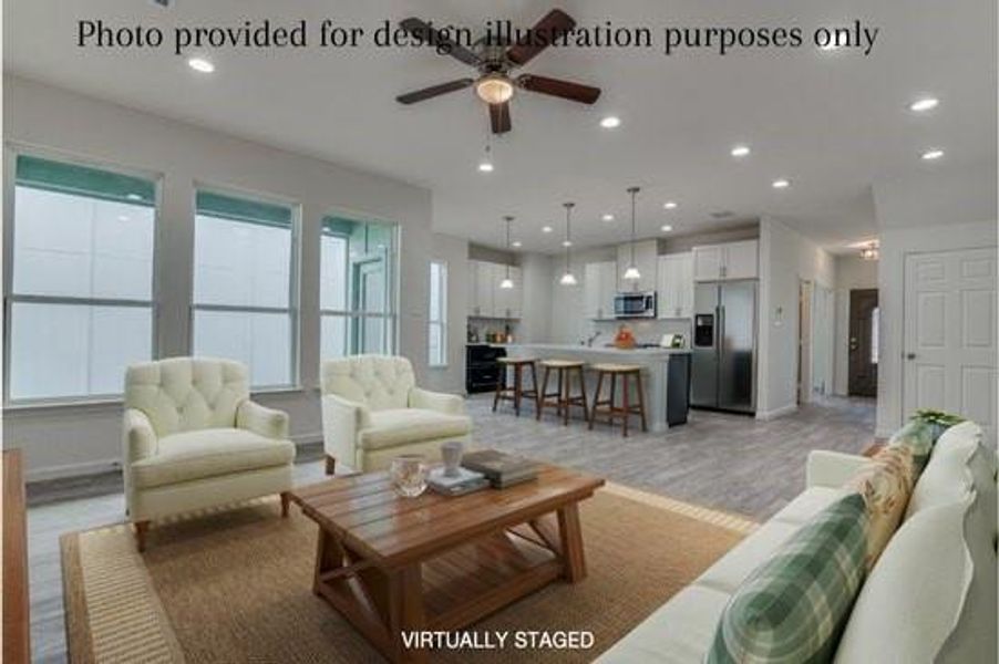 Example of living room featuring a wealth of natural light, hardwood / wood-style flooring, and ceiling fan