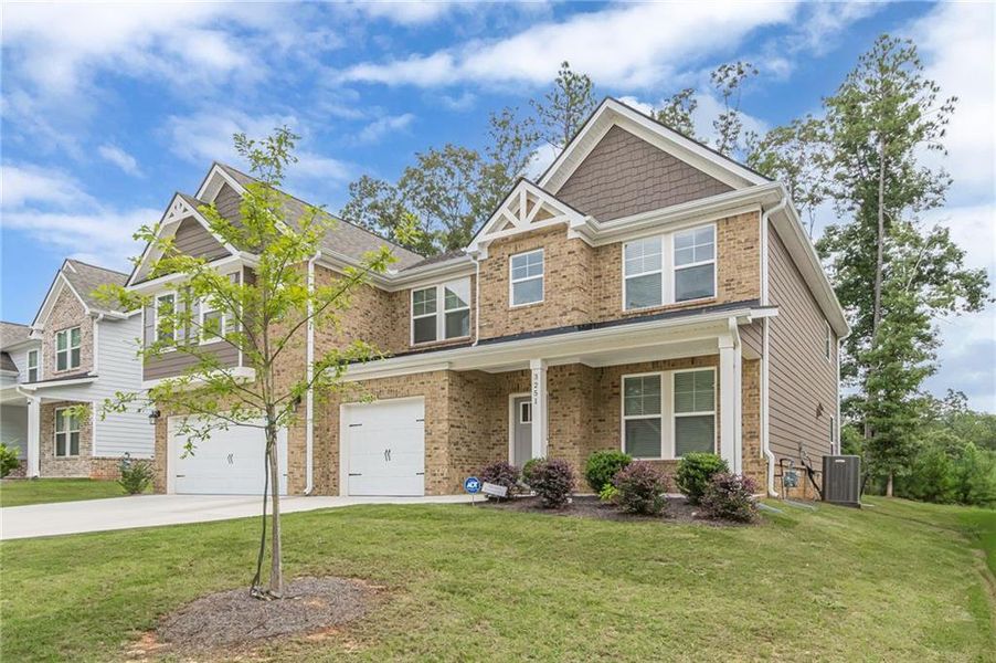 Front exterior of a new home in Twin Shoals, Atlanta, GA, highlighting curb appeal (Image 22). Front exterior of a new home in Twin Shoals, Atlanta, GA, highlighting curb appeal (Image 22).