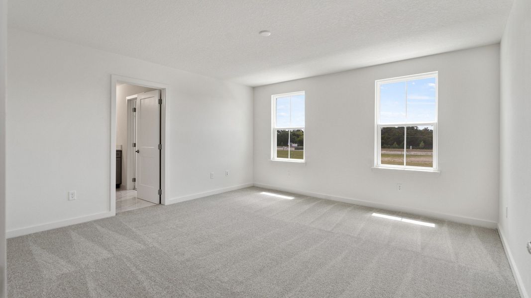 Large Primary Suite in the Mandarin model by DRB Homes at Trinity Place in Saint Cloud FL Large Primary Suite in the Mandarin model by DRB Homes at Trinity Place in Saint Cloud FL