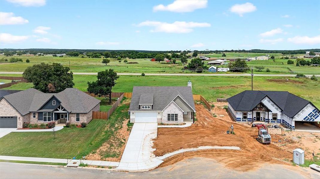 Front exterior of a new home in , Callisburg, TX, highlighting curb appeal (Image 16).