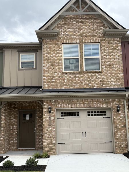 Front exterior of a new home in Talia Trace, Smyrna, TN, highlighting curb appeal (Image 1).