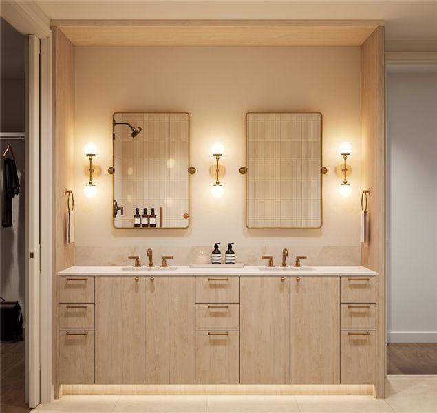 Primary bathroom in the Tranquil palette. Honed limestone tile adds a gentle, natural texture underfoot, while cappuccino-toned shower tile introduces warmth with a contemporary stacked layout. Polished Taj Mahal quartzite counters complete the look with subtle movement and a clean finish.