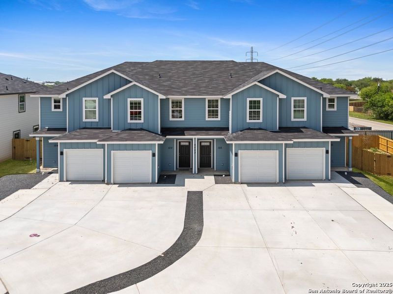 Front exterior of a new home in The Preserve at Candlemeadow, San Antonio, TX, highlighting curb appeal (Image 1).