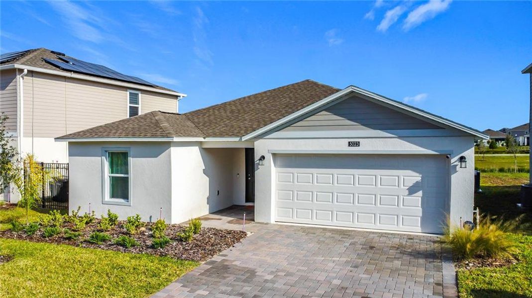 Front exterior of a new home in Providence, Davenport, FL, highlighting curb appeal (Image 28).