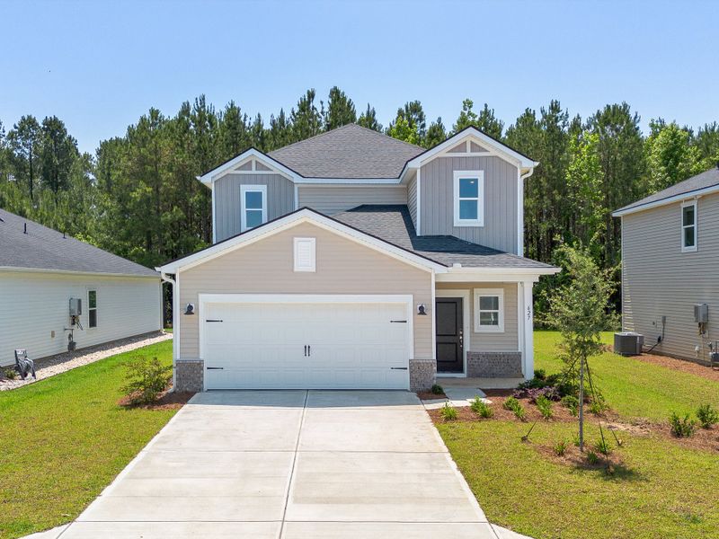 Front exterior of a new home in Waterside - Boardwalk Series, Longs, SC, highlighting curb appeal (Image 1). Front exterior of a new home in Waterside - Boardwalk Series, Longs, SC, highlighting curb appeal (Image 1).