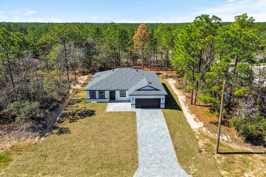 Front exterior of a new home in , Citrus Springs, FL, highlighting curb appeal (Image 17).