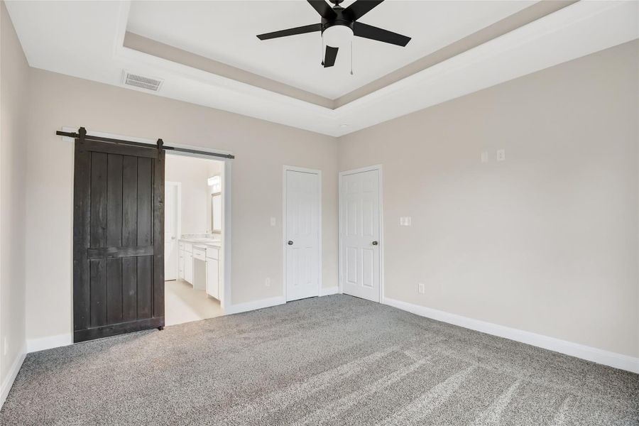 Sliding barn door for primary bedroom entrance into the primary bath.