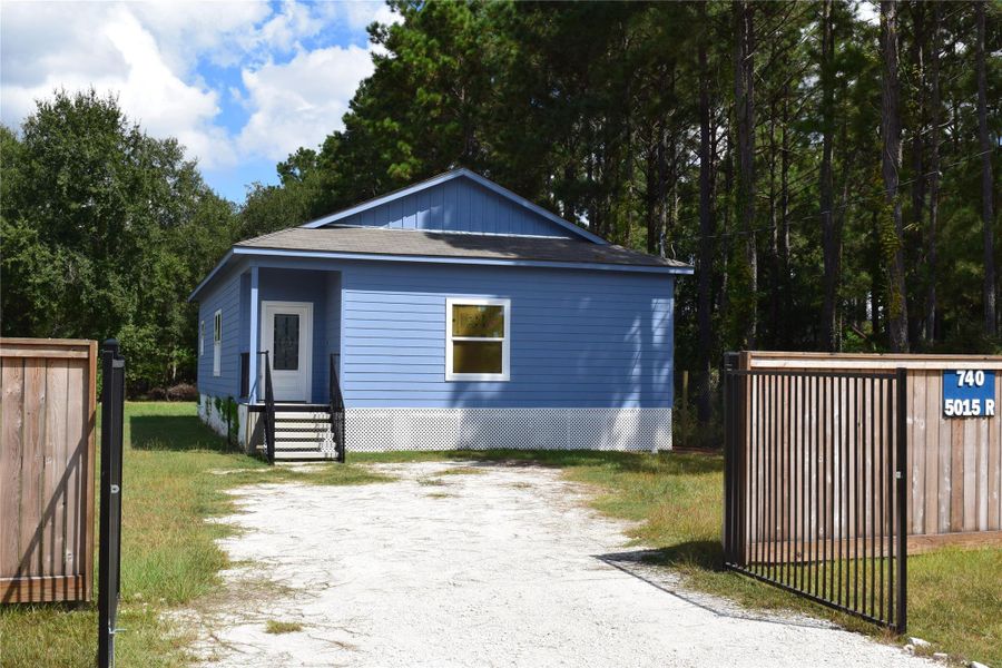 Front exterior of a new home in , Cleveland, TX, highlighting curb appeal (Image 16).