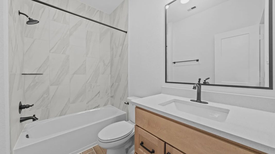 Representative furnished interior of a home built from the Rivers by Chesmar Homes in Sofi Lakes, Katy (Image 13).