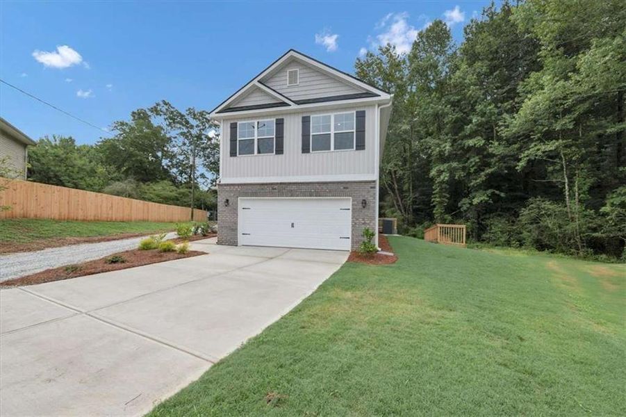 Front exterior of a new home in Scarlett Place, Bowdon, GA, highlighting curb appeal (Image 21).