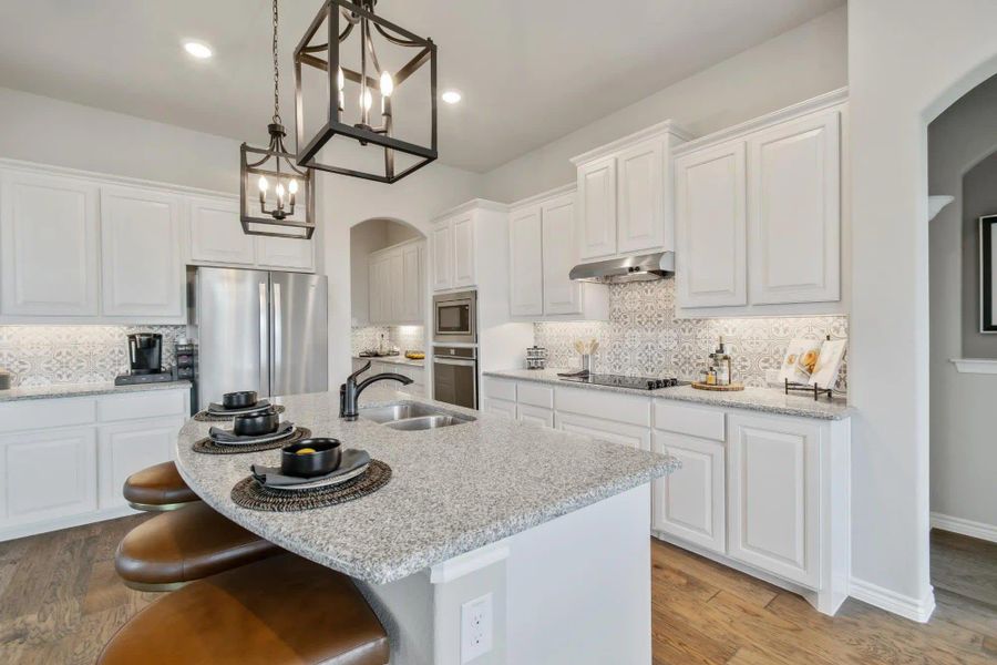 Kitchen | Concept 2434 at Coyote Crossing in Godley, TX by Landsea Homes