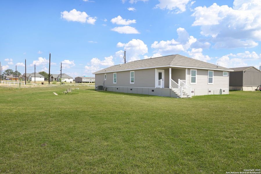 Front exterior of a new home in , Atascosa, TX, highlighting curb appeal (Image 14). Front exterior of a new home in , Atascosa, TX, highlighting curb appeal (Image 14).
