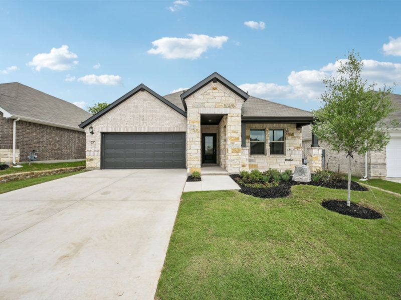Front exterior of a new home in Westmoor, Sherman, TX, highlighting curb appeal (Image 1). Front exterior of a new home in Westmoor, Sherman, TX, highlighting curb appeal (Image 1).