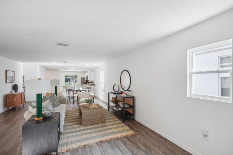 A living room with a large window.
