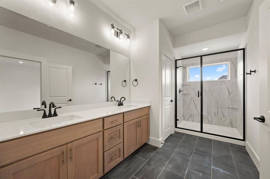 You'll never want to leave this owner's bath that features a spacious walk in shower with window!!