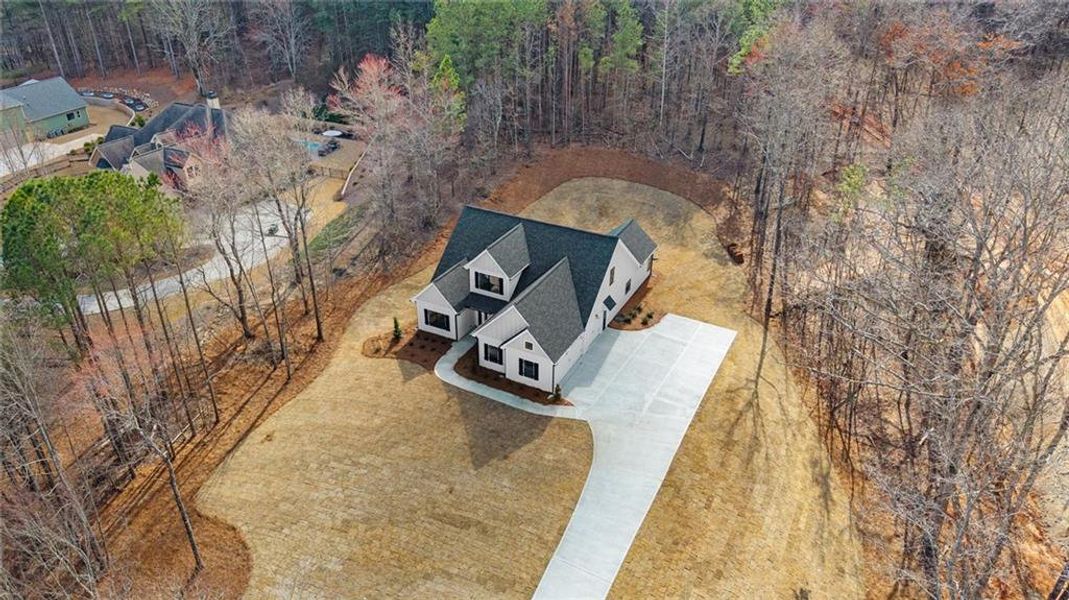 Front exterior of a new home in , Carrollton, GA, highlighting curb appeal (Image 23).