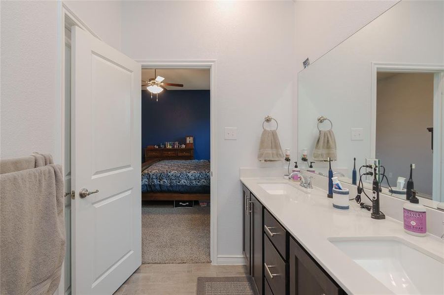 Bathroom featuring ceiling fan and vanity