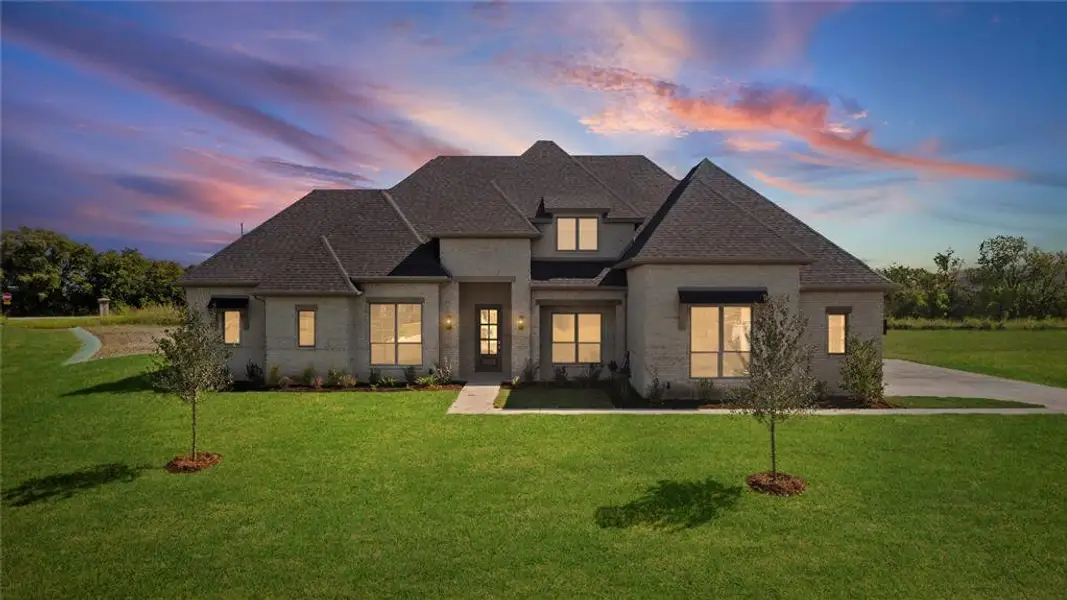 Front exterior of a new home in Tuscan Estates (1 Acre Lots), Waxahachie, TX, highlighting curb appeal (Image 1). Front exterior of a new home in Tuscan Estates (1 Acre Lots), Waxahachie, TX, highlighting curb appeal (Image 1).