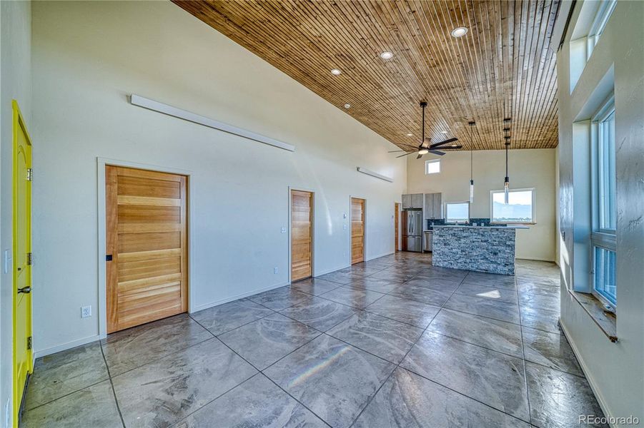 Living space with concrete floors and pocket doors