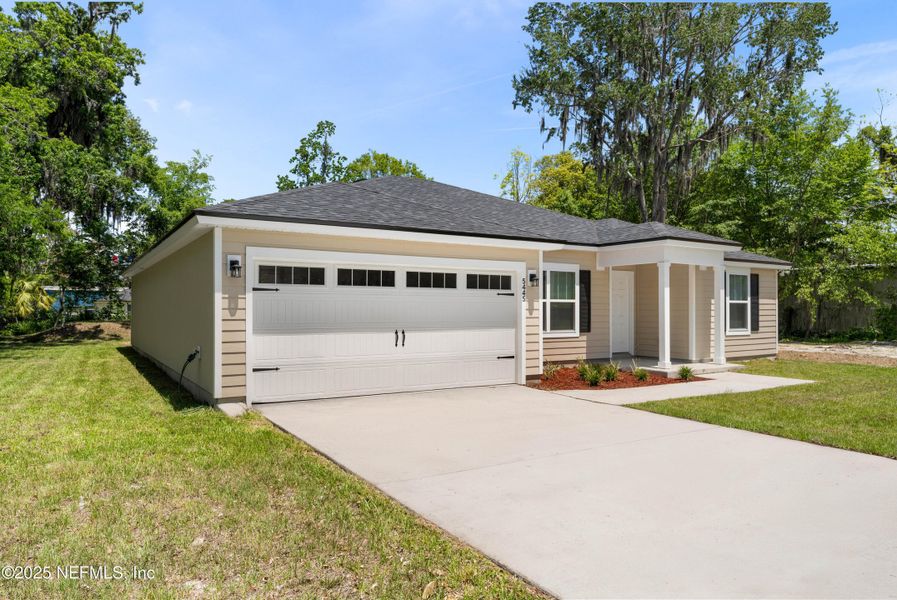 Front exterior of a new home in , Jacksonville, FL, highlighting curb appeal (Image 21). Front exterior of a new home in , Jacksonville, FL, highlighting curb appeal (Image 21).