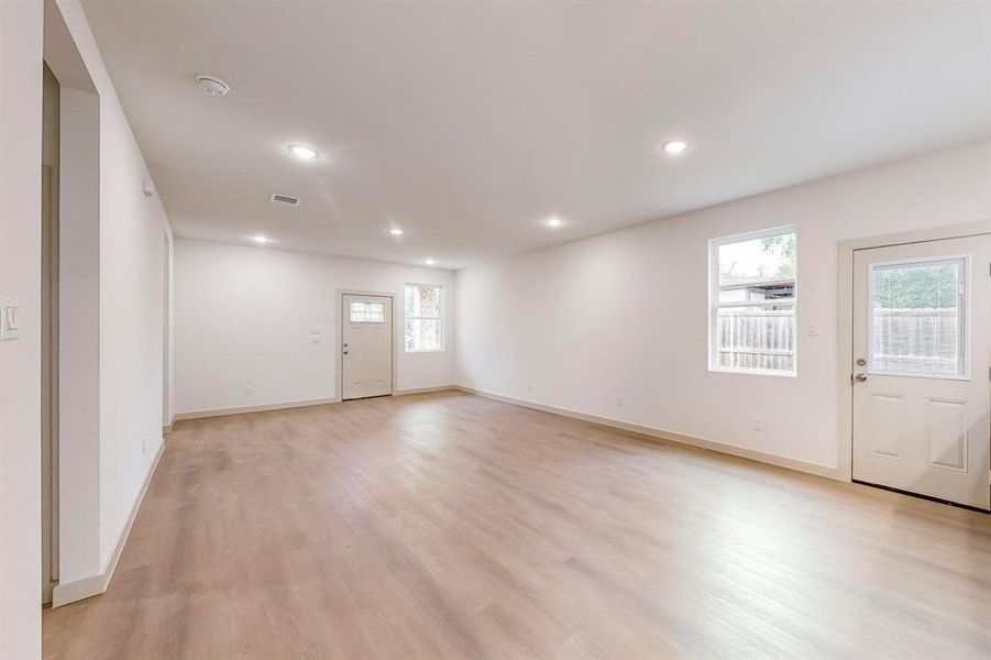 Entrance foyer with light hardwood / wood-style floors