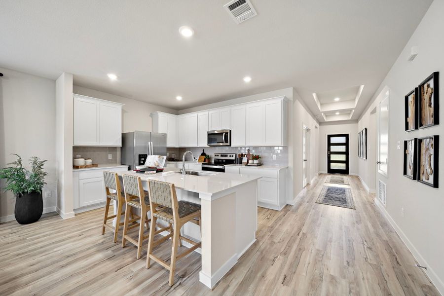 A kitchen with white cabinets. A kitchen with white cabinets.