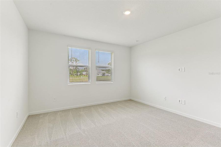 Spacious, unfurnished interior of a new home in Colbert Landings, Palm Coast (Image 30).