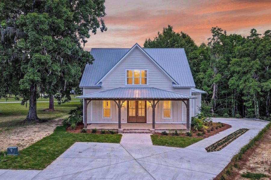 Front exterior of a new home in , Georgetown, SC, highlighting curb appeal (Image 1). Front exterior of a new home in , Georgetown, SC, highlighting curb appeal (Image 1).
