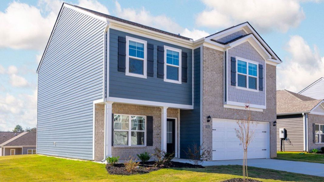 Front exterior of a new home in Hillcrest Landing, McDonald, TN, highlighting curb appeal (Image 2).