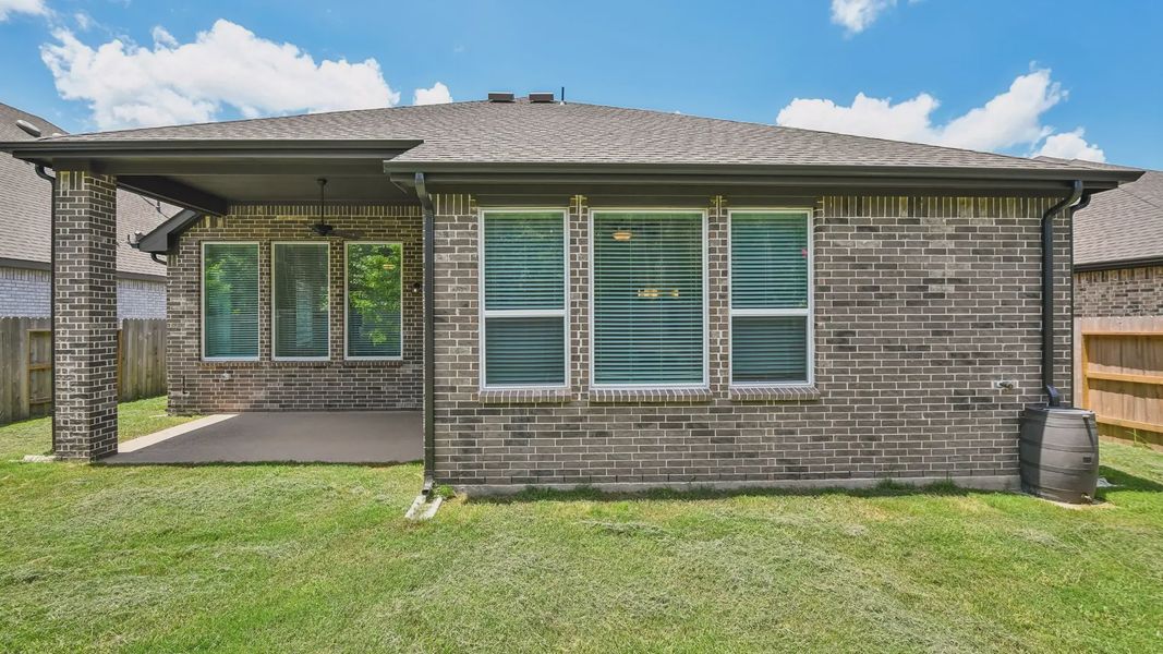 Exterior details and patio area of a home in Artavia, Conroe (Image 4).