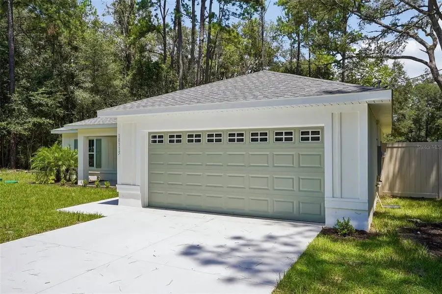 Front exterior of a new home in , Citrus Springs, FL, highlighting curb appeal (Image 1). Front exterior of a new home in , Citrus Springs, FL, highlighting curb appeal (Image 1).