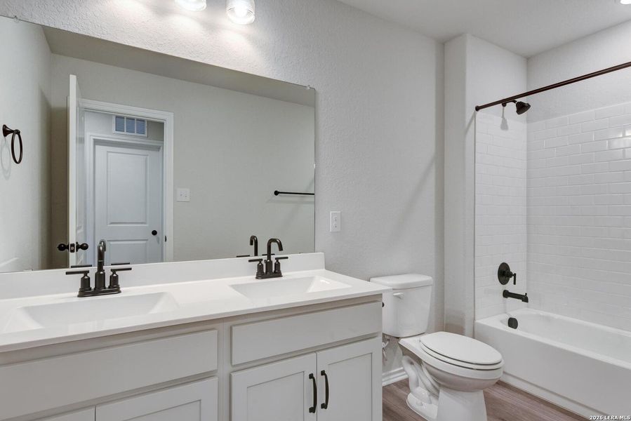 Furnished interior view inside a new home in Hennersby Hollow, San Antonio (Image 10).
