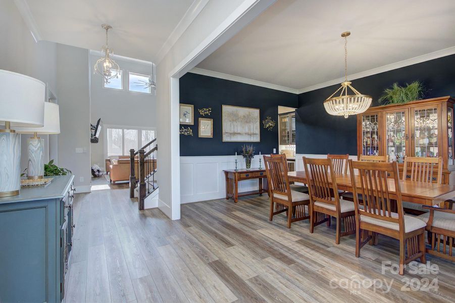 Beautiful entryway opens to the formal dining room and private office space