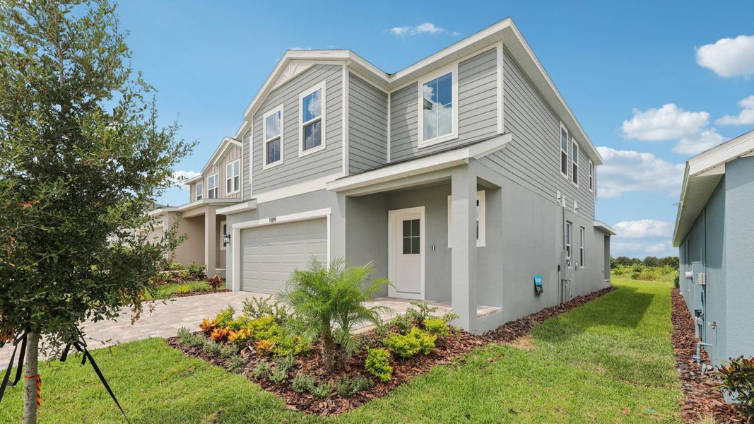 Representative exterior photo of a completed home built from the Naples by DRB Homes in Hamilton Bluff, Haines City, FL (Image 7).