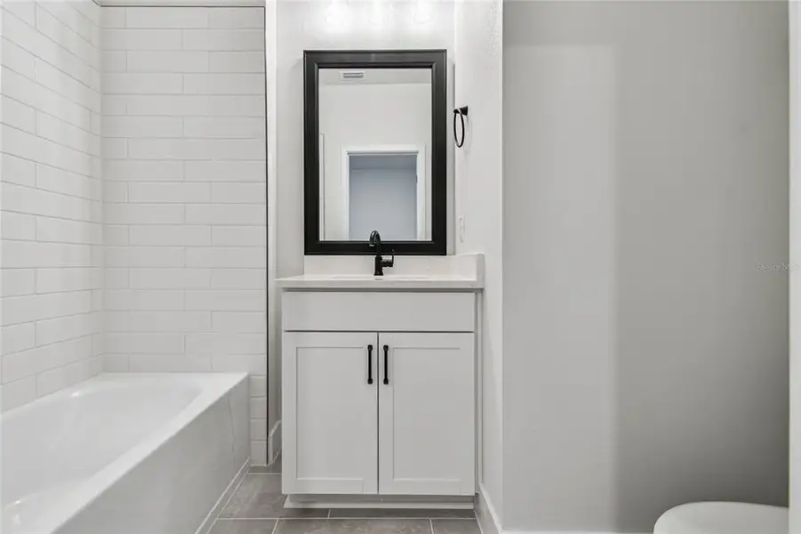 Furnished interior view inside a new home in Towns at Union, St. Petersburg (Image 9).