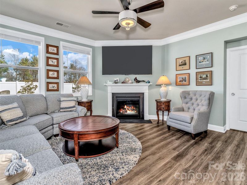 Bright and lovely living room with cozy fireplace