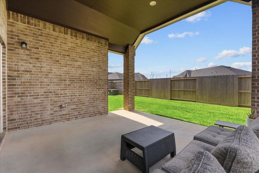 Step outside to an oversized extended covered patio featuring a beautiful stained vaulted ceiling, offering the perfect space for outdoor entertaining, relaxing, and enjoying year-round gatherings. The spacious backyard still provides plenty of room to create your own outdoor oasis. Step outside to an oversized extended covered patio featuring a beautiful stained vaulted ceiling, offering the perfect space for outdoor entertaining, relaxing, and enjoying year-round gatherings. The spacious backyard still provides plenty of room to create your own outdoor oasis.