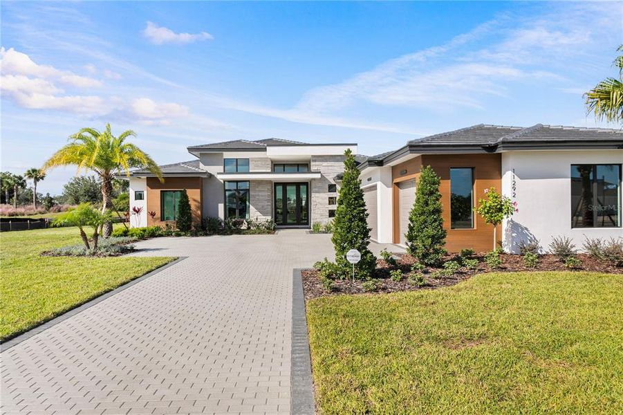 Front exterior of a new home in , Odessa, FL, highlighting curb appeal (Image 24).
