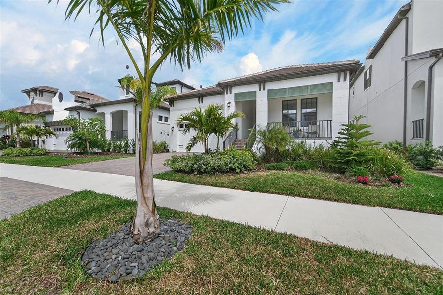Front exterior of a new home in SouthShore Yacht Club, Ruskin, FL, highlighting curb appeal (Image 28). Front exterior of a new home in SouthShore Yacht Club, Ruskin, FL, highlighting curb appeal (Image 28).