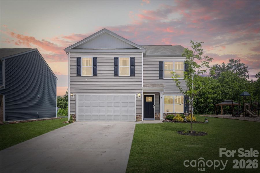 Front exterior of a new home in Patton Cove, Clyde, NC, highlighting curb appeal (Image 22).