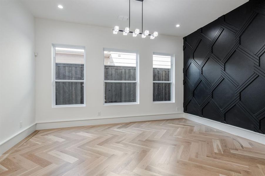 Spare room featuring baseboards and recessed lighting Spare room featuring baseboards and recessed lighting