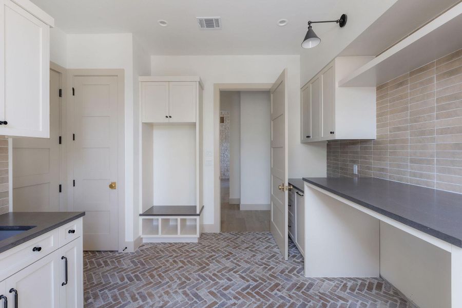 Huge laundry room with tons of storage!