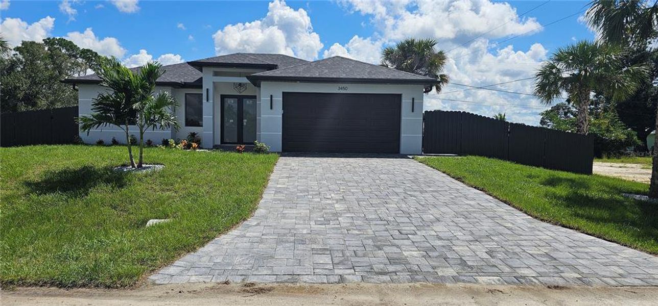 Front exterior of a new home in , Port Charlotte, FL, highlighting curb appeal (Image 27).