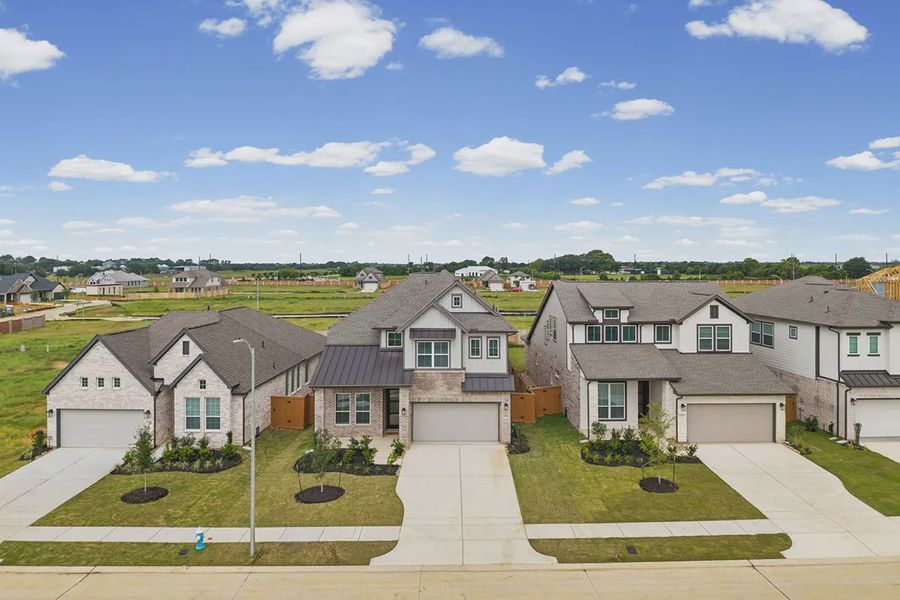Front exterior of a new home in Wildrye 45', Waller, TX, highlighting curb appeal (Image 24). Front exterior of a new home in Wildrye 45', Waller, TX, highlighting curb appeal (Image 24).
