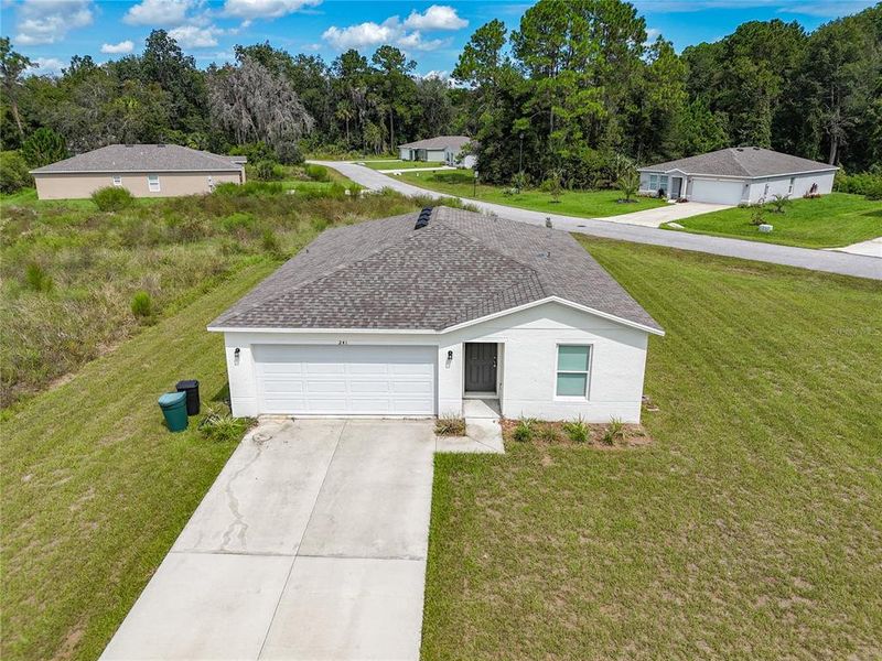 Front exterior of a new home in , Crescent City, FL, highlighting curb appeal (Image 18).