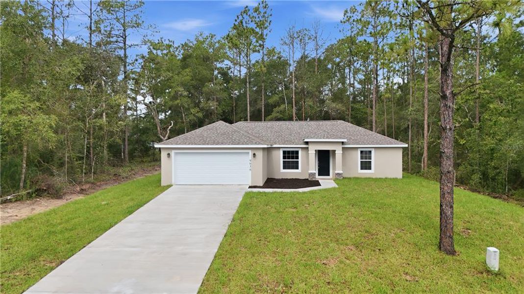 Front exterior of a new home in , Citrus Springs, FL, highlighting curb appeal (Image 22).