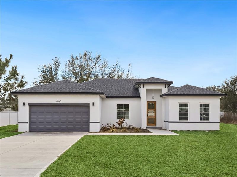 Front exterior of a new home in , Ocala, FL, highlighting curb appeal (Image 21).