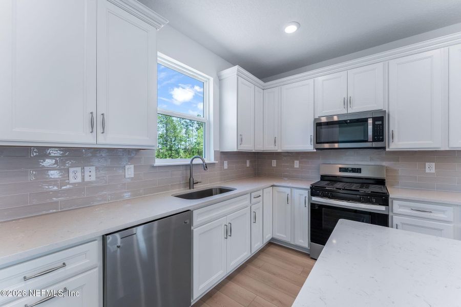 Furnished interior view inside a new home in Del Webb Wildlight, Yulee (Image 9).