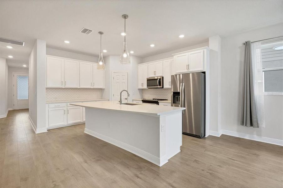 Beautiful Kitchen. Quartz Counter and Tile Back Splash