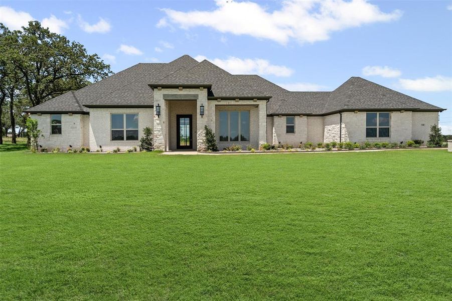 Front exterior of a new home in Santana Ridge, Weatherford, TX, highlighting curb appeal (Image 17). Front exterior of a new home in Santana Ridge, Weatherford, TX, highlighting curb appeal (Image 17).